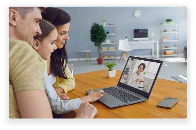 Family speaking with a doctor over an online video call