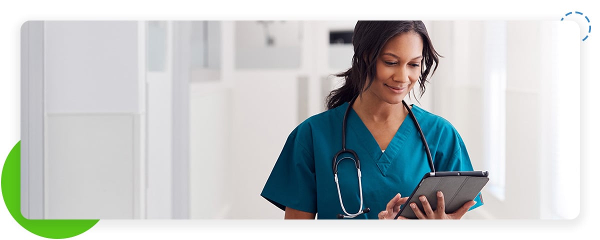 Nurse looking at tablet Nurse looking at tablet